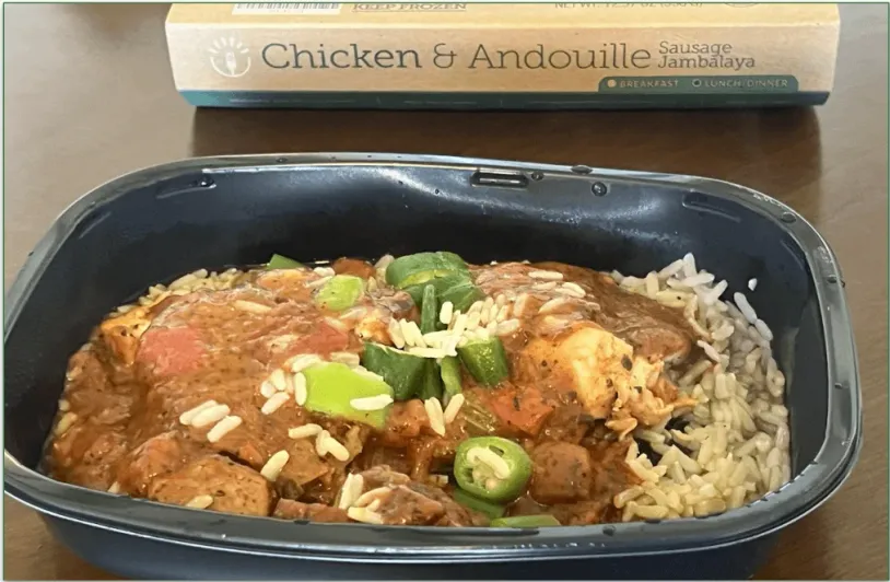 Photo of BistroMD's Chicken & Andouille Sausage Jambalaya dish in a microwaveable tray in front of its cardboard sleeve packaging