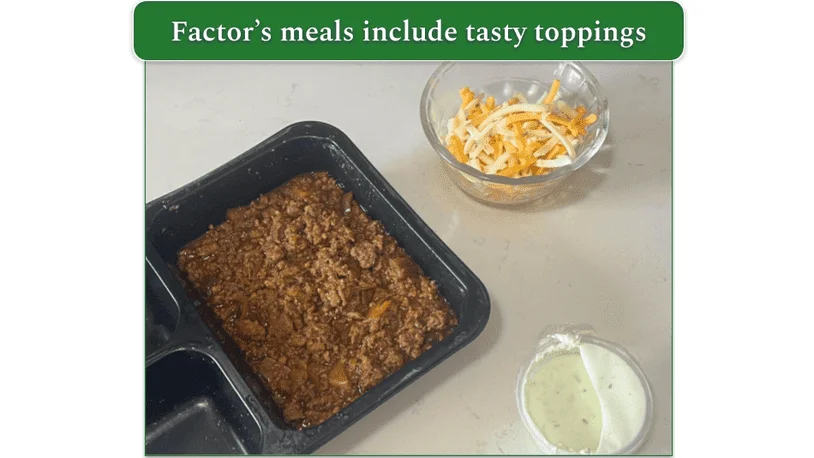 Factor’s Chorizo Chili alongside dishes of shredded cheese and sour cream