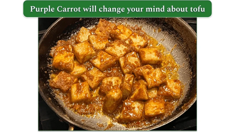 Pieces of tofu and sauce in a frying pan