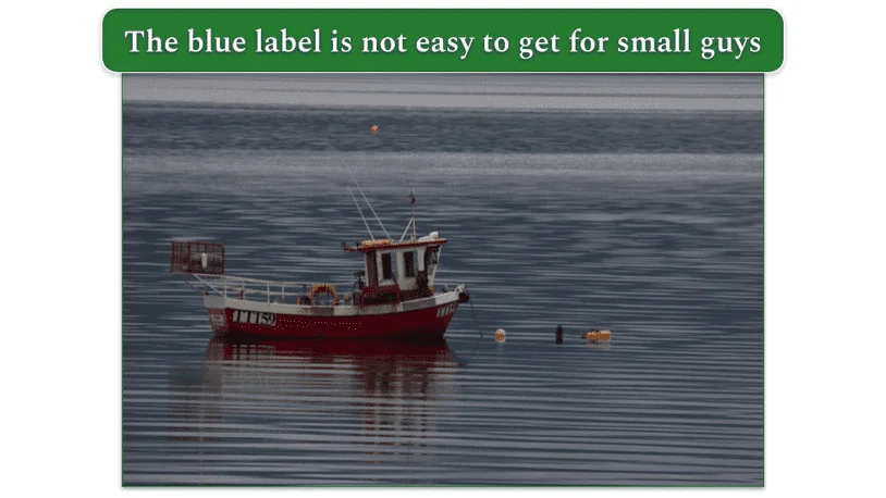 A small fishing boat, in the open waters