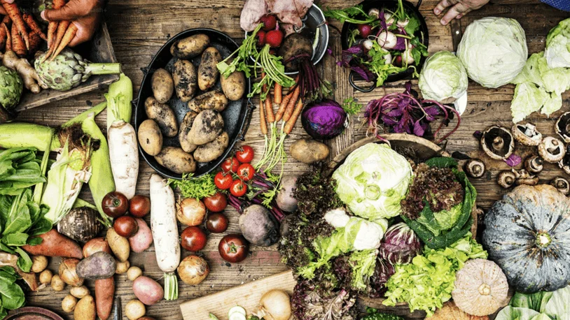 a spread of organic foods on a wooden table