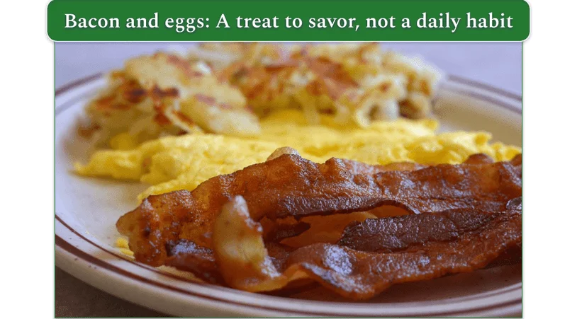 Plate of crispy bacon slices and eggs