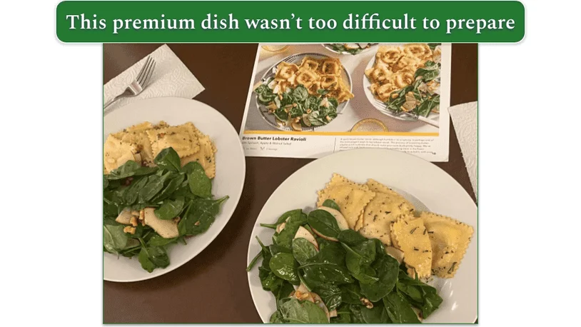 Two plates of brown butter lobster ravioli with the recipe card behind