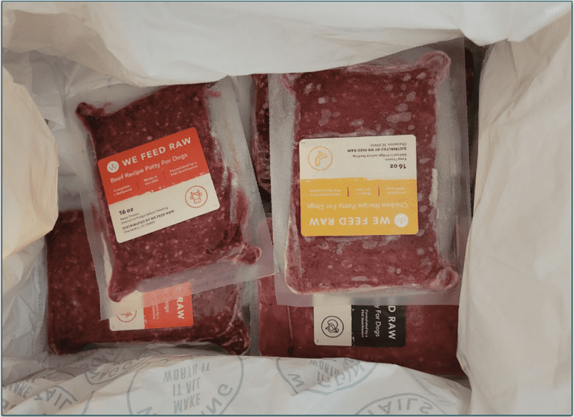 Open We Feed Raw delivery box with frozen packs