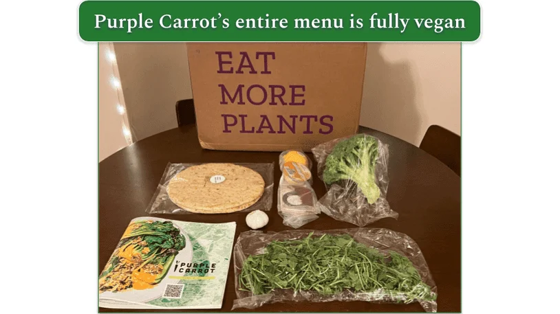 An assortment of vegan ingredients on a table with a Purple Carrot box