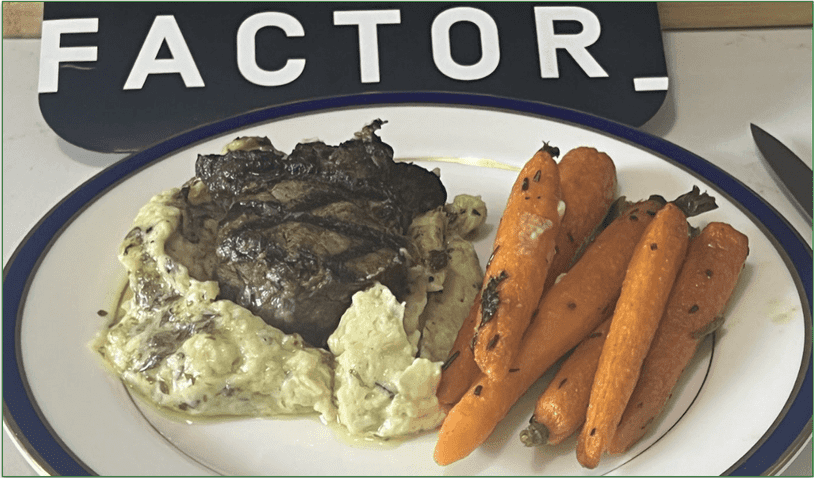 Photo of Factor's Truffle Butter Filet Mignon dish served on a plate in front of Factor's packaging