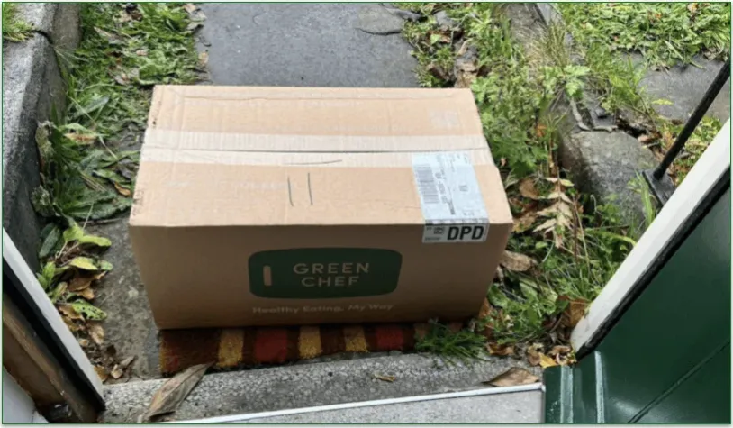 A newly-arrived Green Chef package on a porch by a front door