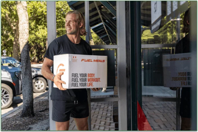 Person delivering a Fuel Meals box