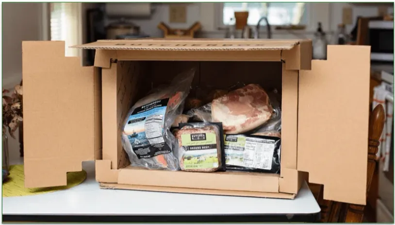 An open Butcher Box delivery with the contents inside