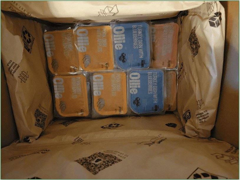 Open Ollie box with pork, turkey, and beef options