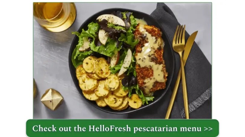 A plate of pecan-crusted trout with roasted potatoes and a salad with sliced apples