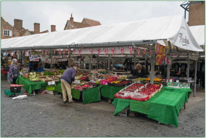 People shopping at a local farmer's market.