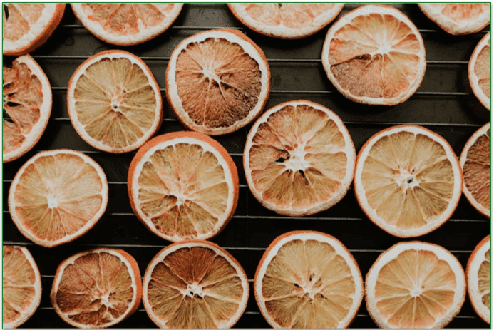 Dehydrated citrus fruits on a tray.