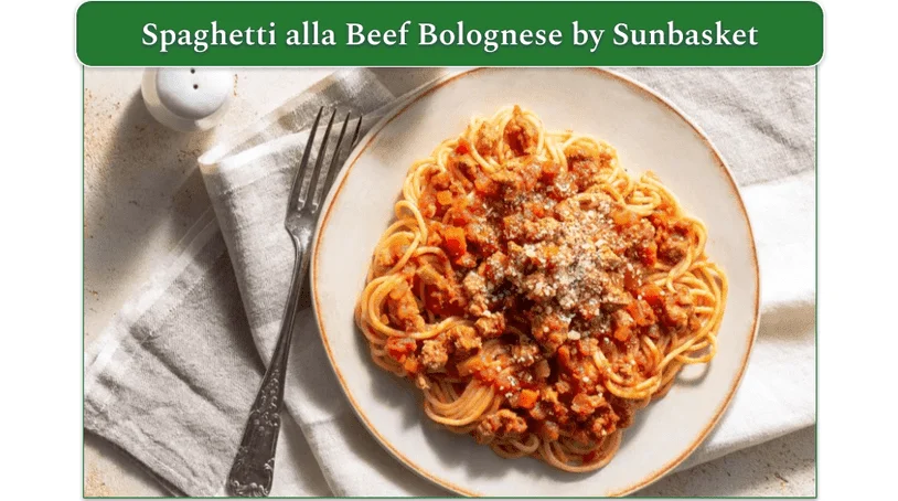 A plate of spaghetti on a white plate.