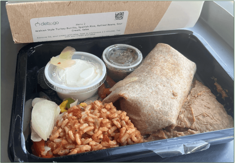 Diet-to-Go's Mexican Style Turkey Burrito in a microwaveable tray next to the cardboard packaging sleeve