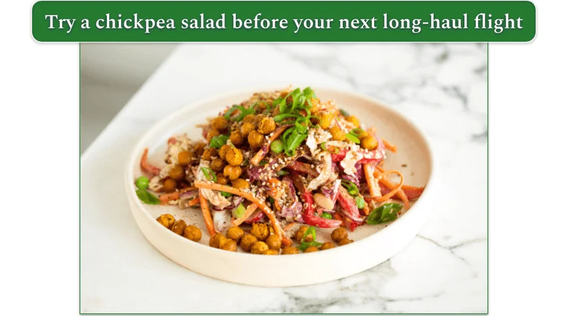 a plate of salad with chickpeas and various other veggies