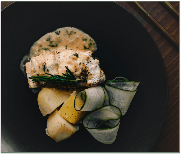 Baked Cod with Vegetables on a plate