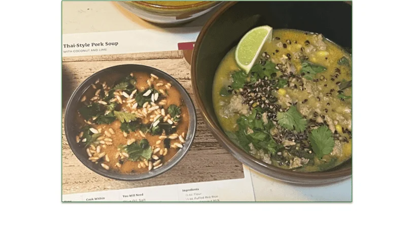 Photo of the Thai-Style Pork Soup in a bowl next to the recipe card