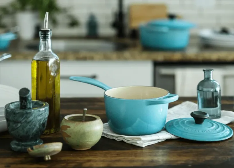 Cooking utensils and a bottle of cooking oil