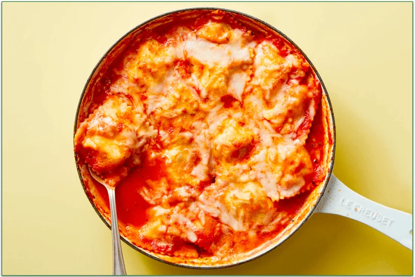 An ovenproof skillet full of ravioli