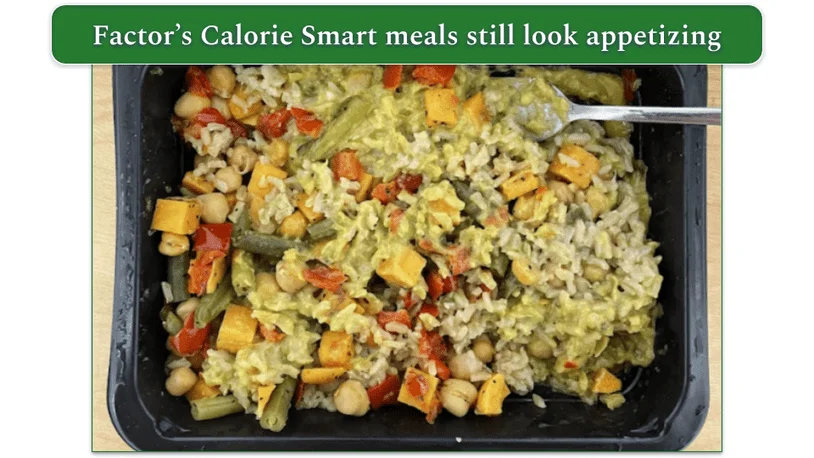 Photo of Factor's Thai Roasted Vegetable Green Curry cooked in a microwaveable tray with a fork ready to eat