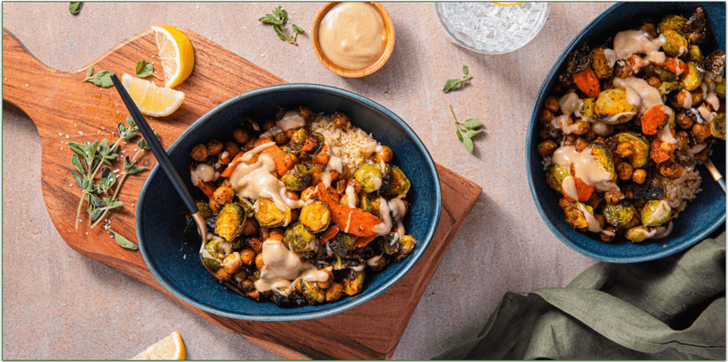 Two bowls of vegan Brussels sprouts and chickpeas