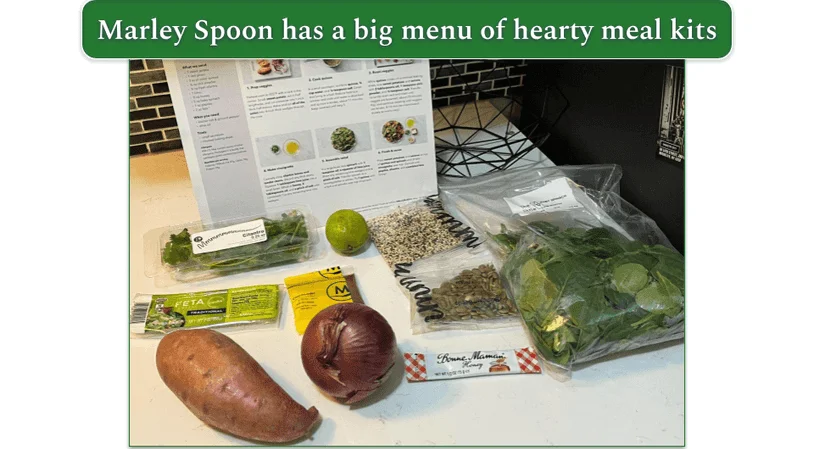 Ingredients laid out for Marley Spoon’s Superfood Spinach & Quinoa Salad