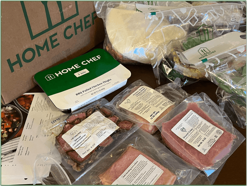 Unboxed Home Chef order showing proteins in their packages pre-cooking
