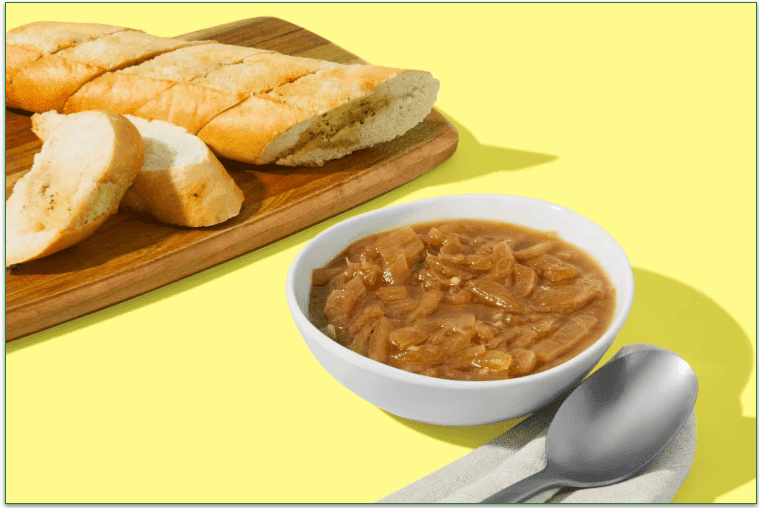 Bowl of soup and garlic baguette from HelloFresh