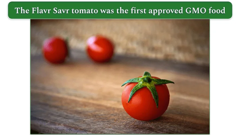a photo of 3 tomatoes on a wooden table