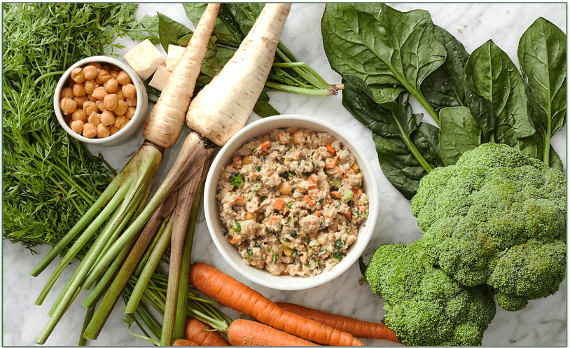 The Farmer's Dog meal in a bowl surrounded by fresh ingredients