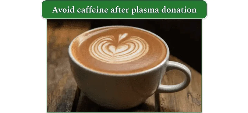 a cup of coffee on a wooden table