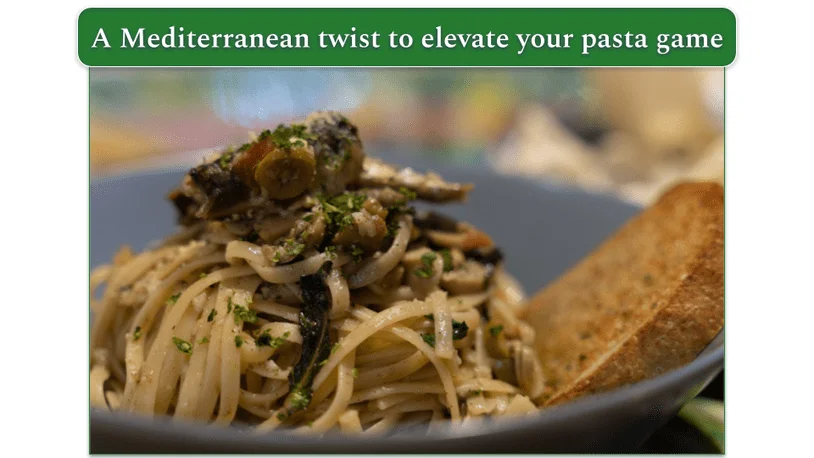 A dish of Sardine Mediterranean Pasta served with crusty bread