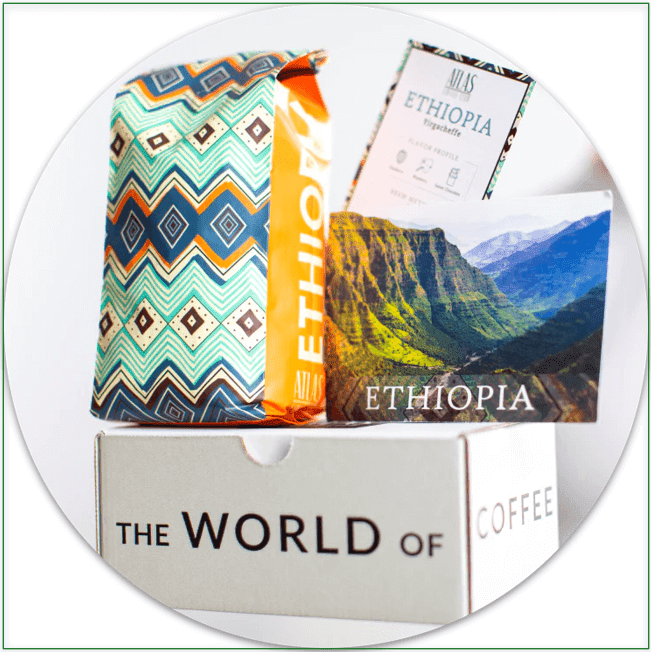 Image of Ethiopian coffee, a postcard, and tasting notes on top of a delivery box