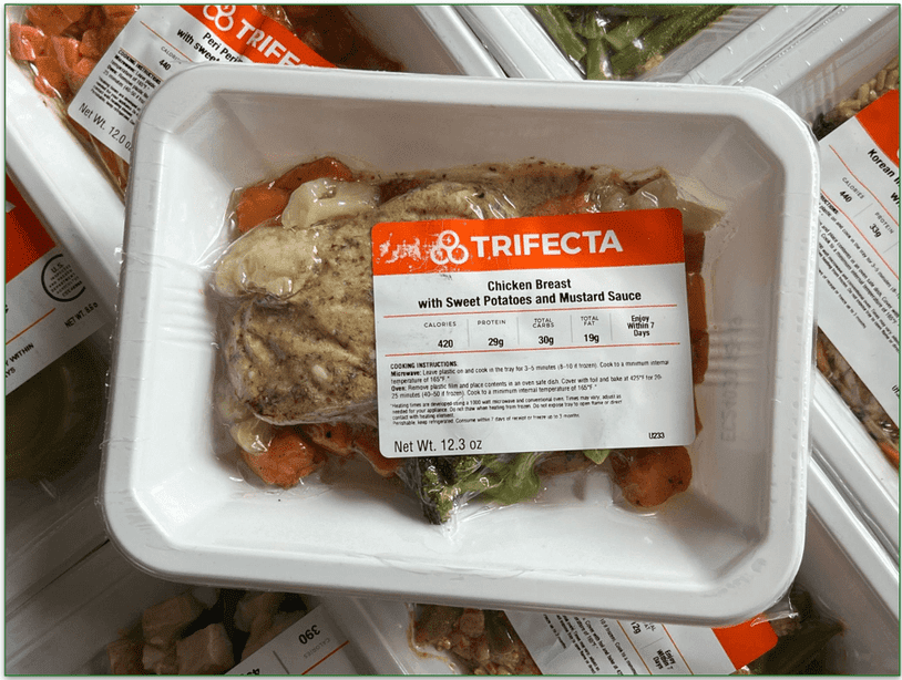 Image of Trifecta's app displayed on a mobile showing recent workouts and food log