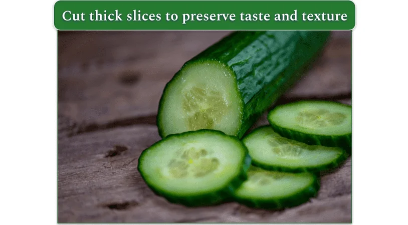A sliced cucumber with a larger unsliced piece next to it