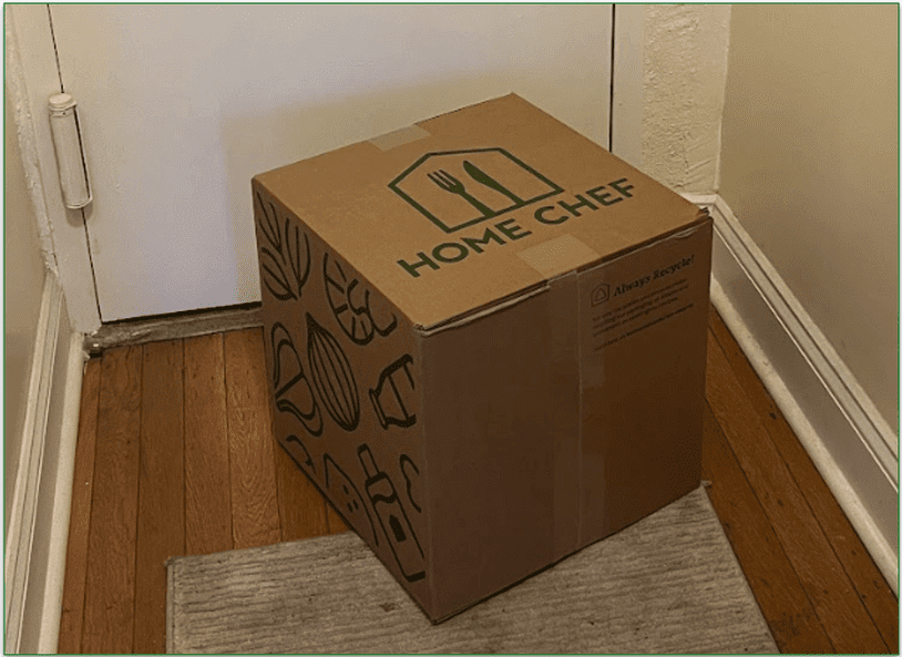 Photo of a Home Chef delivery box outside a door