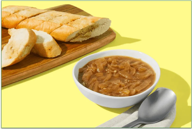 Bowl of soup and garlic baguette from HelloFresh