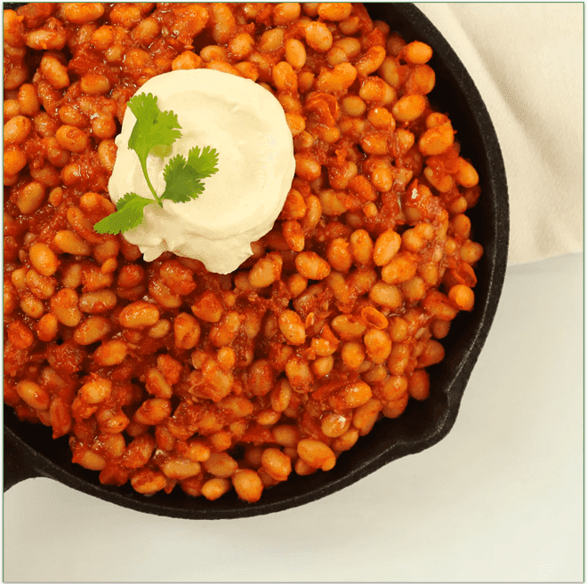 Mama's Baked Beans served in a skillet