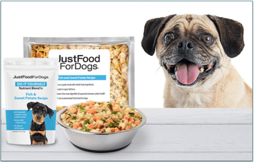 JustFoodForDogs' Nutrient Blend with Fish and Sweet Potato and an enthusiastic dog standing by