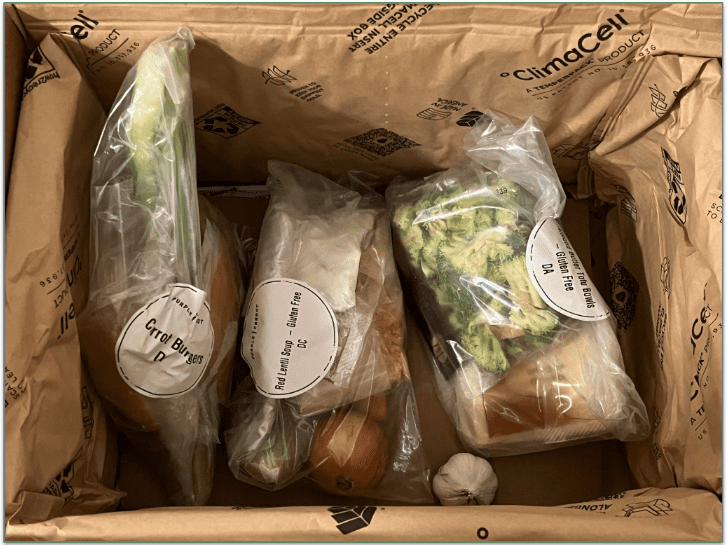 Unboxed Purple Carrot order showing individually wrapped ingredients