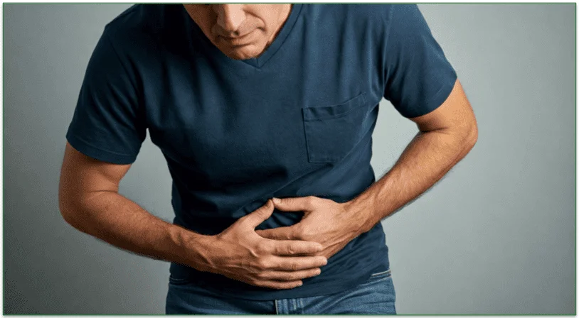 A man holding his abdominal region because of illness.