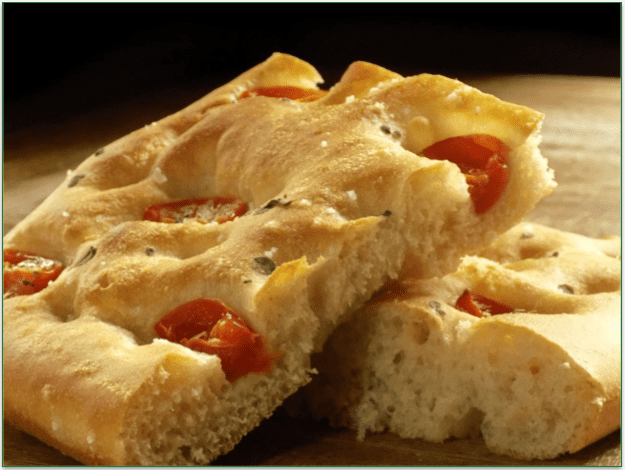 Focaccia with Tomatoes, Onions, and Olives, cut in pieces
