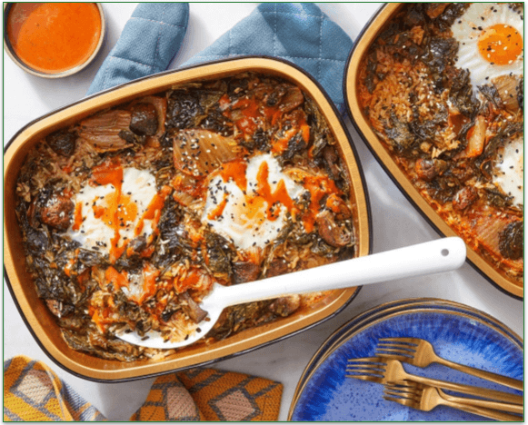 Kimchi rice and eggs with spinach, mushrooms, and spicy sesame sauce.