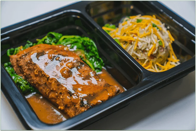 Meal in plastic microwaveable tray