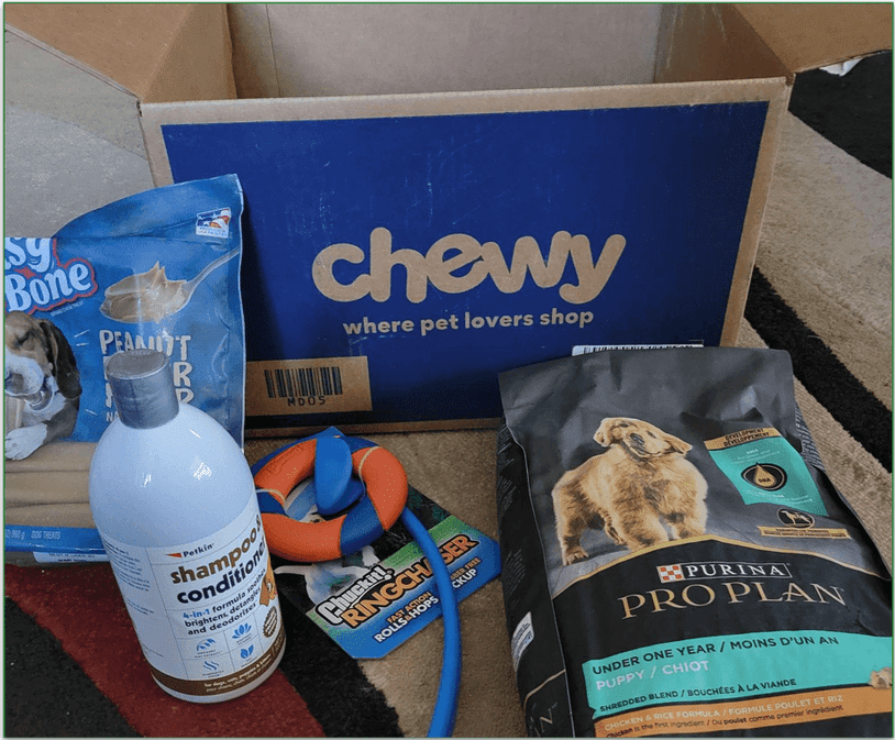 Unboxed Chewy delivery with items placed in front of the box