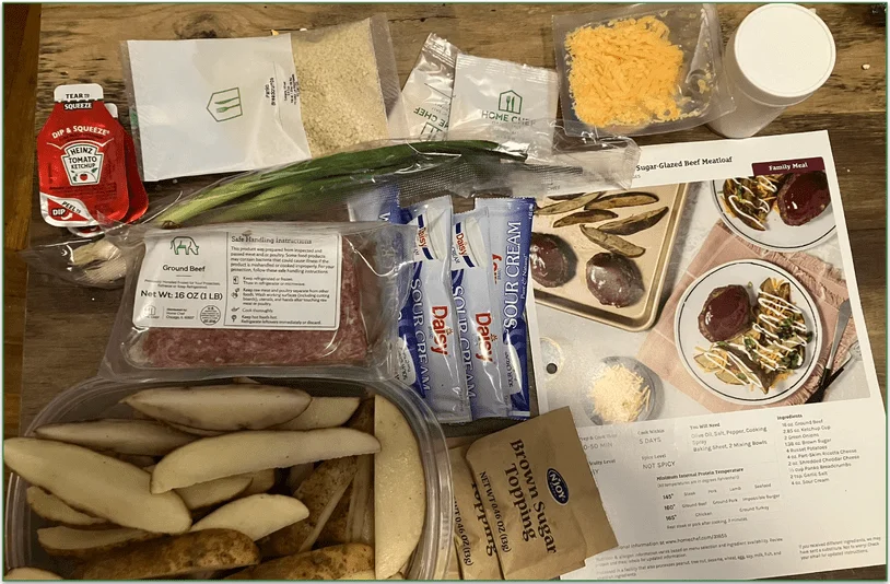 Home Chef's One-Sheet Classic Brown Sugar Glazed Beef Meatloaf with loaded potato wedges