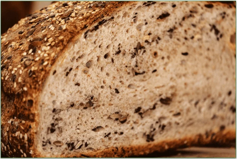 Sliced bread showing grains and seeds inside