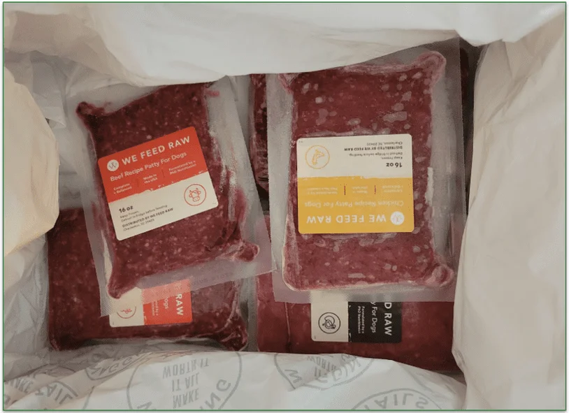 Open We Feed Raw delivery box with frozen packs