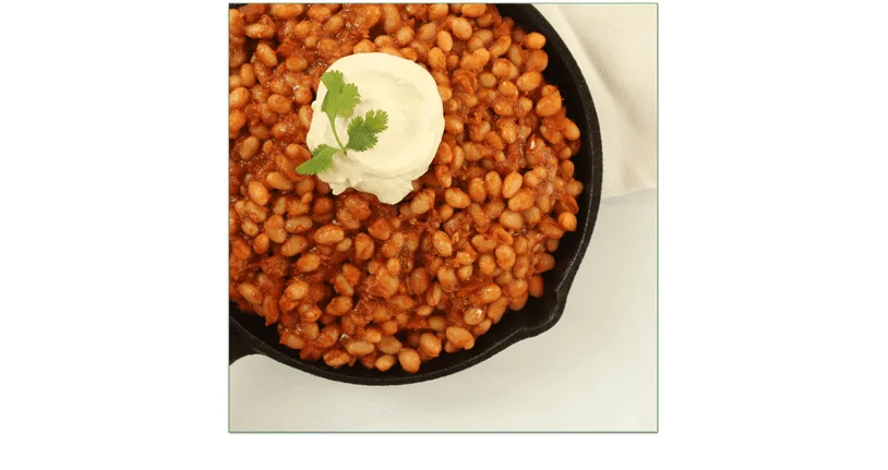 Mama's Baked Beans served in a skillet